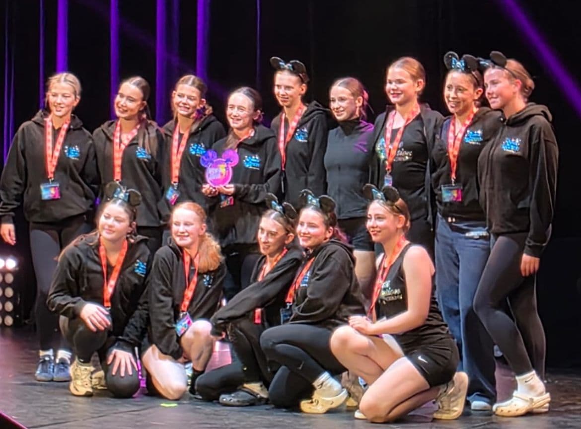 Dance in Motion Academy competition medals and trophy