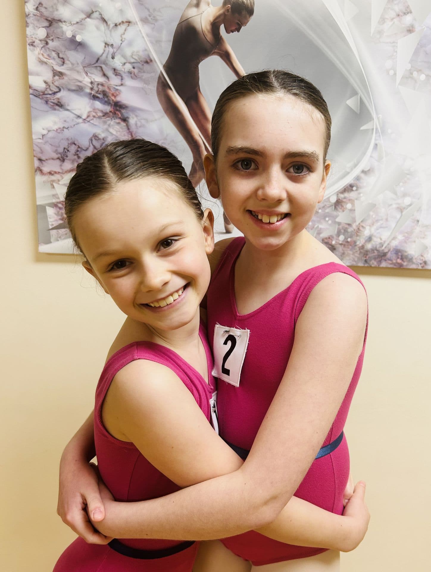 Ballet exam students sharing a hug