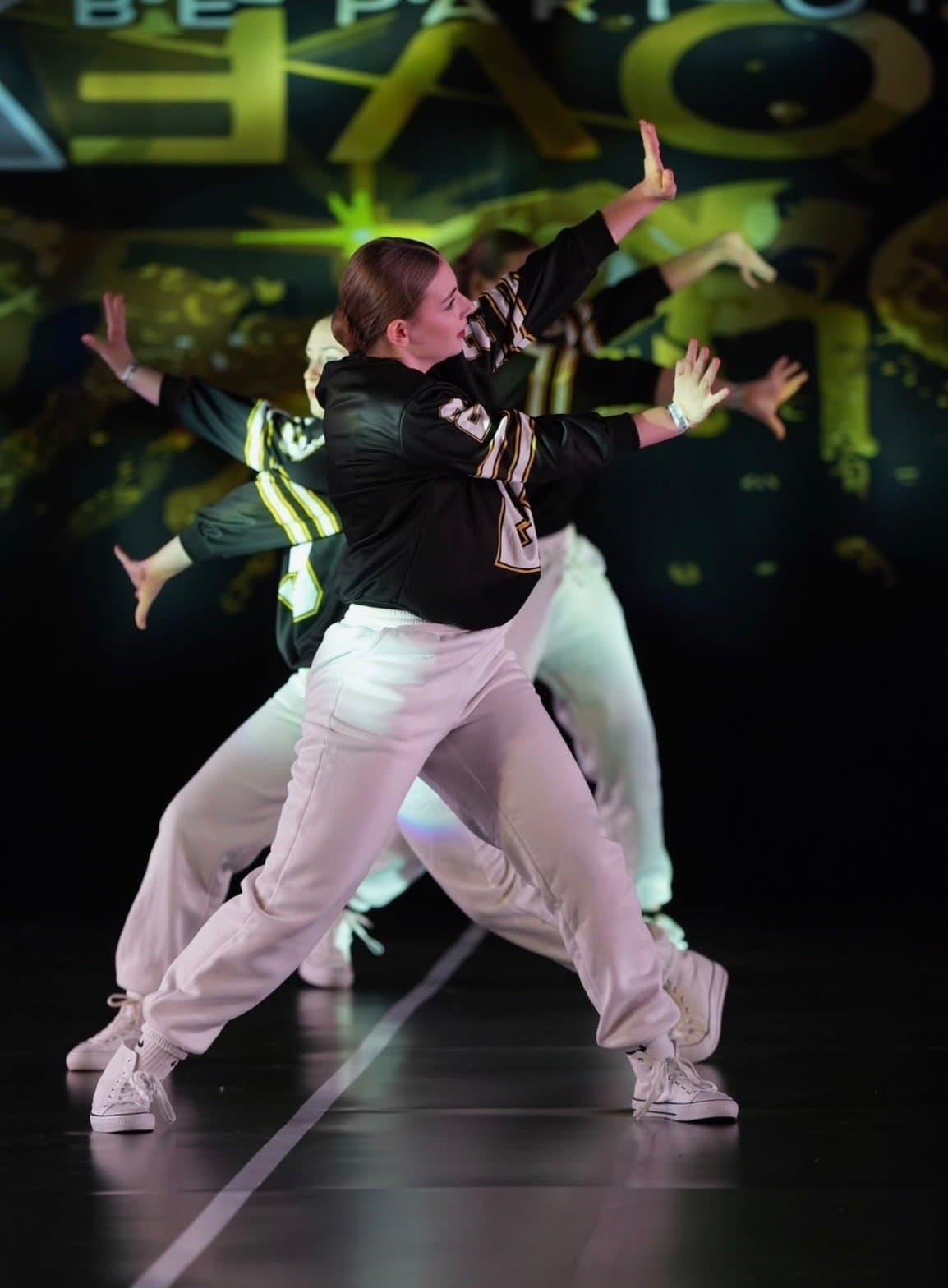 Street and hip hop dancers in varsity jackets