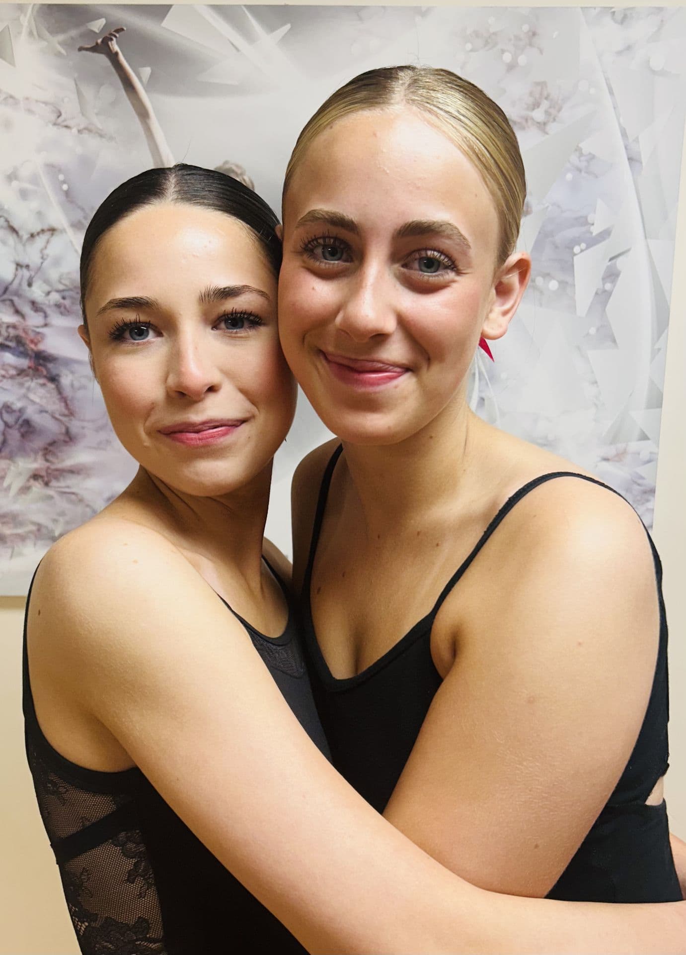 Senior Dance in Motion dancers hugging after a performance